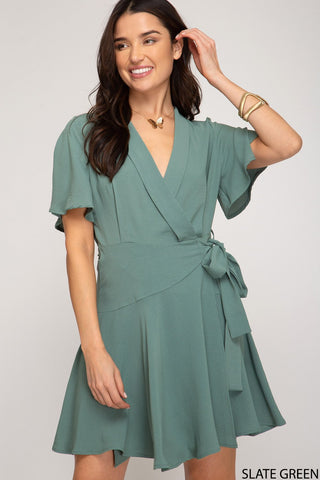 women in a pastel green dress 